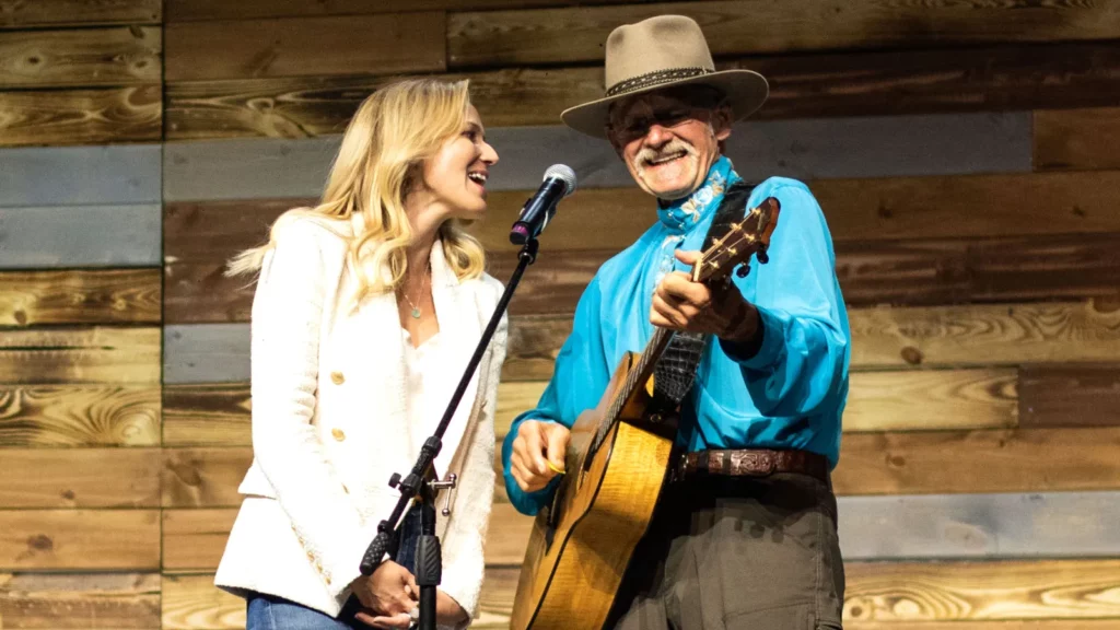 Image of Jewel Kilcher singing with her father Atz Kilcher